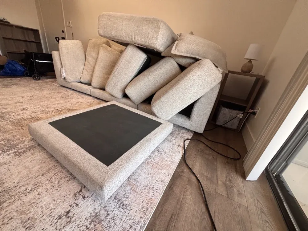 Sofa with all cushions removed during cleaning