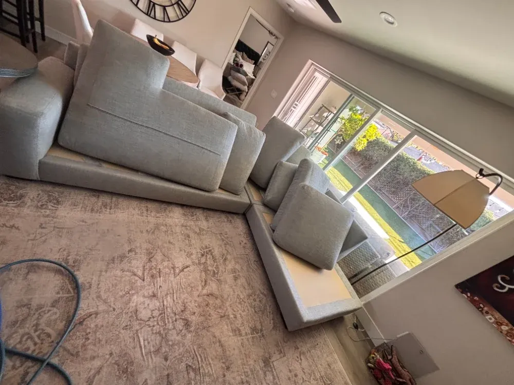 Large fabric sectional in a Chandler home prepared for cleaning